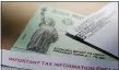  ??  ?? ERIC GAY — THE ASSOCIATED PRESS Stimulus checks, paused student loan payments and the need to stay at home may have helped you cut back on your debt for the first time. Keep that momentum going and take control of your finances.