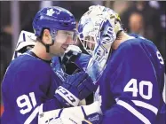  ?? Nathan Denette / Associated Press ?? The Toronto Maple Leafs’ John Tavares (91) and goaltender Garret Sparks celebrate after defeating the Los Angeles Kings in 2018.