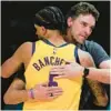  ?? RICK BOWMER/AP ?? Coach Pau Gasol embraces Paolo Banchero of the Magic during the NBA Rising Stars tournament on Friday.