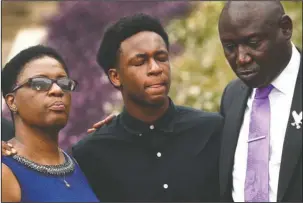  ?? The Associated Press ?? MOURNING: Brandt Jean, center, brother of Botham Jean, cries as he attends a news conference outside the Frank Crowley Courts Building on Monday in Dallas, about the shooting of Botham Jean by Dallas police officer Amber Guyger on Sept 6. He was joined by his mother, Allison Jean and attorney Benjamin Crump.