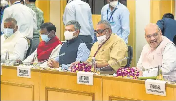  ?? PTI ?? Union home minister Amit Shah (extreme right) chairs a high-level meeting with chief ministers of ten Maoist-hit states at Vigyan Bhawan in New Delhi on Sunday.