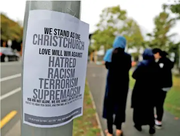  ??  ?? A sign is seen after Friday's mosque attacks outside a community center near Masjid Al Noor in Christchur­ch, New Zealand. Reuters/Jorge Silva