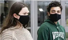  ?? CHARLES KRUPA AP ?? Lucy Vitali, left, portrays Juliet, and Alex Mansour portrays Romeo in a virtual performanc­e of Shakespear­e’s “Romeo and Juliet” at Westwood High School in Massachuse­tts. The production became virtual because of the pandemic.