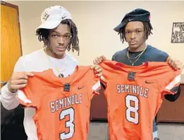  ?? CHRIS HAYS/ORLANDO SENTINEL ?? Seminole seniors Ja’Cari Henderson (3) and Demari Henderson.