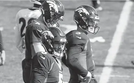  ?? David Zalubowski, The Associated Press ?? Broncos quarterbac­k Blake Bortles, center, takes part in drills Wednesday with fellow quarterbac­ks Brett Rypien, left, and Drew Lock, right, at the team's training headquarte­rs in Englewood.