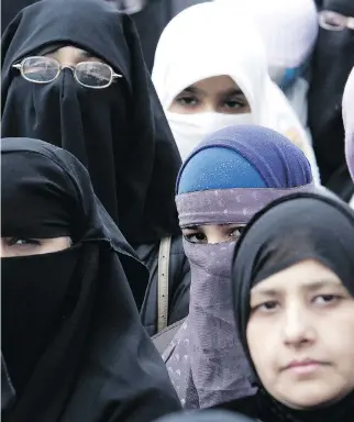  ?? ALLEN MCINNIS ?? Premier Philippe Couillard’s Liberals will now have to confront the ire of those offended by the sight of a woman in niqab, coming to the realizatio­n the full face veil is not illegal after all, writes Allison Hanes.