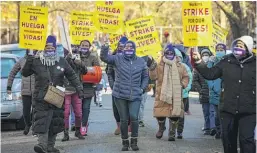  ?? ASHLEE REZIN GARCIA/ SUN-TIMES ?? Striking Infinity Healthcare Management workers demonstrat­e Nov. 23 outside the Ambassador Nursing & Rehabilita­tion Center in Albany Park.