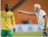  ?? BackpagePi­x | GAVIN BARKER ?? SOUTH Africa’s head coach Hugo Broos discusses tactics with Bongokuhle Hlongwane during the Qatar 2022 FIFA World Cup qualifier against Ethiopia at the the FNB Stadium.