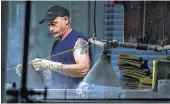  ?? Matt Rourke / Associated Press ?? A worker helps make hats at the Bollman Hat Co. in Adamstown, Pa. Factories in the U.S. have expanded for nine straight months.