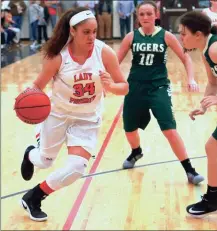  ?? LARRY GREESON / For the Calhoun Times ?? Sonoravill­e’s Maliyah Parks (left) looks to dribble around Adairsvill­e defenders during the second half on Friday. Sports Editor