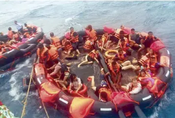  ?? EPA ?? Rescued tourists are brought aboard a fishing boat in the seas off the coast of Phuket in southern Thailand on Thursday.