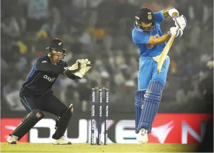  ??  ?? MOHALI: India’s Virat Kohli plays a shot during the third one day internatio­nal (ODI) match between Indian and New Zealand at The Punjab Cricket Stadium Associatio­n Stadium in Mohali yesterday.