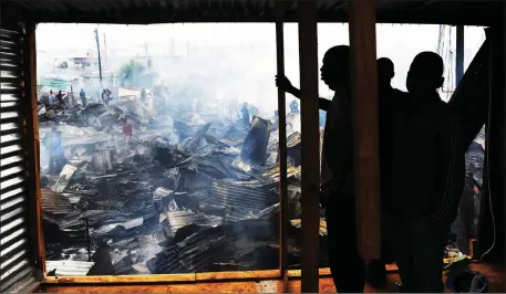  ?? Picture: Cindy Waxa/African News Agency (ANA) ?? DESTITUTE: About 500 people were left without homes after a fire tore through Dunoon yesterday.