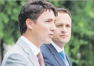  ?? CP PHOTO ?? Prime Minister Justin Trudeau, left, speaks to the media as Irish Taoiseach Leo Varadkar looks on at Farmleigh House on Tuesday in Dublin.