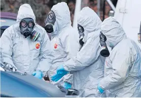  ??  ?? Police in protective suits during investigat­ions into the Salisbury attack