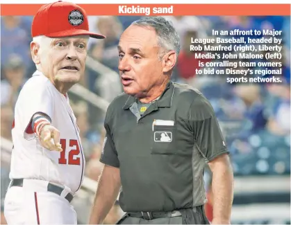  ??  ?? In an affront to Major League Baseball, headed by Rob Manfred (right), Liberty Media’s John Malone (left) is corralling team owners to bid on Disney’s regional sports networks.