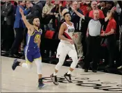  ?? ASSOCIATED PRESS ?? GOLDEN STATE WARRIORS guard Stephen Curry (left) celebrates as he runs next to Portland Trail Blazers guard CJ McCollum (center) at the end of Game 4 of the NBA Western Conference finals Monday in Portland, Ore.