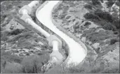  ?? Brian van der Brug Los Angeles Times ?? WATER CASCADES down a hill at the terminus of the Los Angeles Aqueduct in Sylmar.