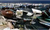  ?? AFP ?? The remains of boats used by migrants to cross the Mediterran­ean are scattered along the port of El-Amra in Tunisia’s Sfax governorat­e.