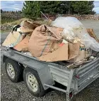  ??  ?? A trailer-load of wind-blown rubbish a man collected from his property over six months.