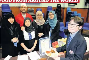  ??  ?? Delicious Darren Rae, 12, samples Indian food provided by Multan restaurant, in Paisley National dishes Aisha Oyededo, 14, with Nigerian dish Jollof Rice and Eva Bonar, 13, with Scotland’s own haggis, neeps and tatties