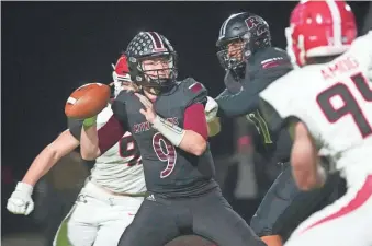  ?? PATRICK BREEN/THE REPUBLIC ?? Mesa Red Mountain quarterbac­k Carter Crispin passes against Phoenix Brophy Prep during a Class 6A playoff game.