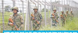  ??  ?? KASHMIR: India’s Border Security Force (BSF) soldiers patrol along the India-Pakistan border in Akhnoor near Jammu yesterday after the Indian government stripped Jammu and Kashmir of its autonomy. — AFP