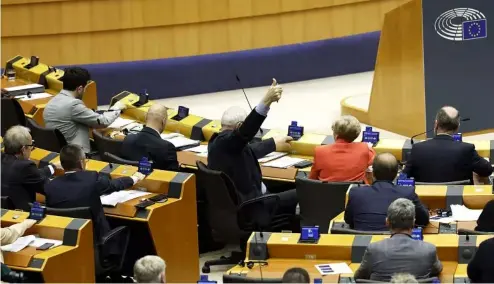  ?? ?? Members of European Parliament participat­e in a series of votes as they attend a plenary session at the European Parliament in Brussels, Wednesday, April 10, 2024.