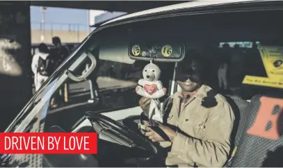  ?? Picture: AFP ?? A sweetheart bear hangs in a taxi at the Bara Taxi Rank in Soweto yesterday. About 1.5 million people returned to work from 1 May as stay-at-home measures were eased and some businesses allowed to partially resume their operations under strict health conditions.