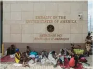  ?? ?? Haitians displaced by gangs from their homes gather outside U.S. Embassy in the capital Port-au-Prince. Additional U.S. Marines have been brought into Haiti.