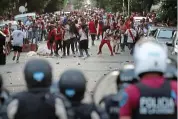  ?? REUTERS ?? Street of shame: fans clash with riot police in Buenos Aires last month