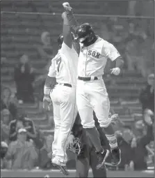  ?? AP/MARY SCHWALM ?? Boston's Deven Marrero (right) celebrates with teammate Christian Vazquez after hitting a two-run home run Thursday against the Rangers at Fenway Park in Boston.