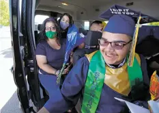  ?? PHOTOS BY LUIS SÁNCHEZ SATURNO/THE NEW MEXICAN ?? Graduate Adam Chavez returns to his party van after receiving his diploma Thursday during the Santa Fe High School graduation ceremony.