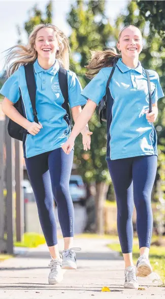  ?? ?? National Walk Safely to School Day is this Friday and twins Isobel and Eloise Henry (12) are getting ready. Picture: Jake Nowakowski