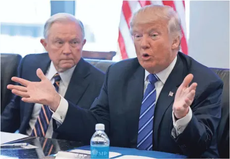  ?? EVAN VUCCI, AP ?? Sen. Jeff Sessions, R-Ala., with Presidente­lect Donald Trump during a recent meeting at Trump Tower.