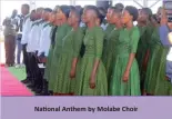  ?? ?? National Anthem by Molabe Choir
Local Poet Mr. Edwin Dikelelelo entertaini­ng guests