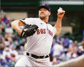  ?? Nuccio DiNuzzo / Getty Images ?? The Red Sox’s Rich Hill throws a pitch during the first inning against the Cubs at Wrigley Field on Friday in Chicago.