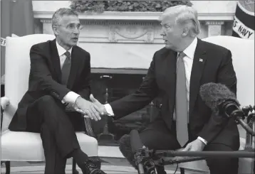  ?? ASSOCIATED PRESS ?? IN THIS MAY 17 FILE PHOTO, President Donald Trump meets with NATO Secretary General Jens Stoltenber­g in the Oval Office of the White House in Washington. Threatenin­g to upend generation­s of global order, Trump’s week-long European trip will test the...