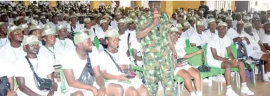  ?? PHOTO: NAN ?? NYSC Director General, Brig.-Gen. Yushau Dogara Ahmed (M) addressing the 2013 Batch ‘C’ Stream Two Corps members, during his visit to Edo State Orientatio­n Camp in Okada on Saturday.