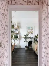  ??  ?? Bamboo wallpaper (Poodle and Blonde) lifts the narrow hallway – and hides fingerprin­ts and pen marks