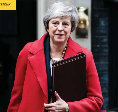  ?? JACK TAYLOR / GETTY IMAGES ?? British Prime Minister Theresa May leaves 10 Downing Street on Tuesday, as three successive failed votes put her plans for Brexit in danger and her position as party leader — and prime minister — on shakier ground.