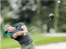  ?? DAVID J. PHILLIP THE ASSOCIATED PRESS ?? Rory Mcilroy tees off on the third hole during a practice round for the Masters golf tournament Wednesday in Augusta, Ga.