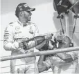  ?? JEROME MIRON, USA TODAY SPORTS ?? Lewis Hamilton sprays champagne on fans Sunday after winning the U. S. Grand Prix.