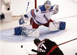  ?? FRANK GUNN/THE CANADIAN PRESS VIA AP ?? Hurricanes right wing Andrei Svechnikov (37) scores his third goal of the game past Rangers goaltender Henrik Lundqvist (30) during the third period in Toronto on Monday.