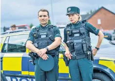  ?? ?? Belfast bobbies: Martin Mccann and Siân Brooke in hit crime drama Blue Lights