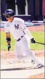  ?? John Minchillo / Associated Press ?? The New York Yankees’ Gleyber Torres hits an RBI single against the Detroit Tigers in the third inning on Saturday.