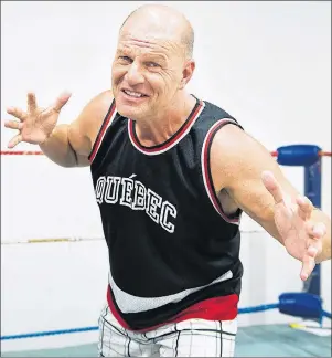  ?? CP PHOTO ?? Former profession­al wrestler Jacques Rougeau poses at his old wrestling school ring Friday in Montreal.