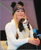  ?? MARCO TROVATI/AP PHOTO ?? Lindsey Vonn holds her dog Lucy as she attends a news conference on Wednesday in Cortina D’Ampezzo, Italy.
