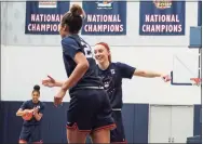  ?? UConn Athletics / Contribute­d Photo ?? UConn freshman Paige Bueckers celebrates a play witth Olivia Nelson-Ododa during practice on Wednesday in Storrs.