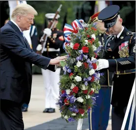  ?? AP/EVAN VUCCI ?? President Donald Trump lays a wreath Monday at the Tomb of the Unknown Soldier at Arlington National Cemetery in Virginia.